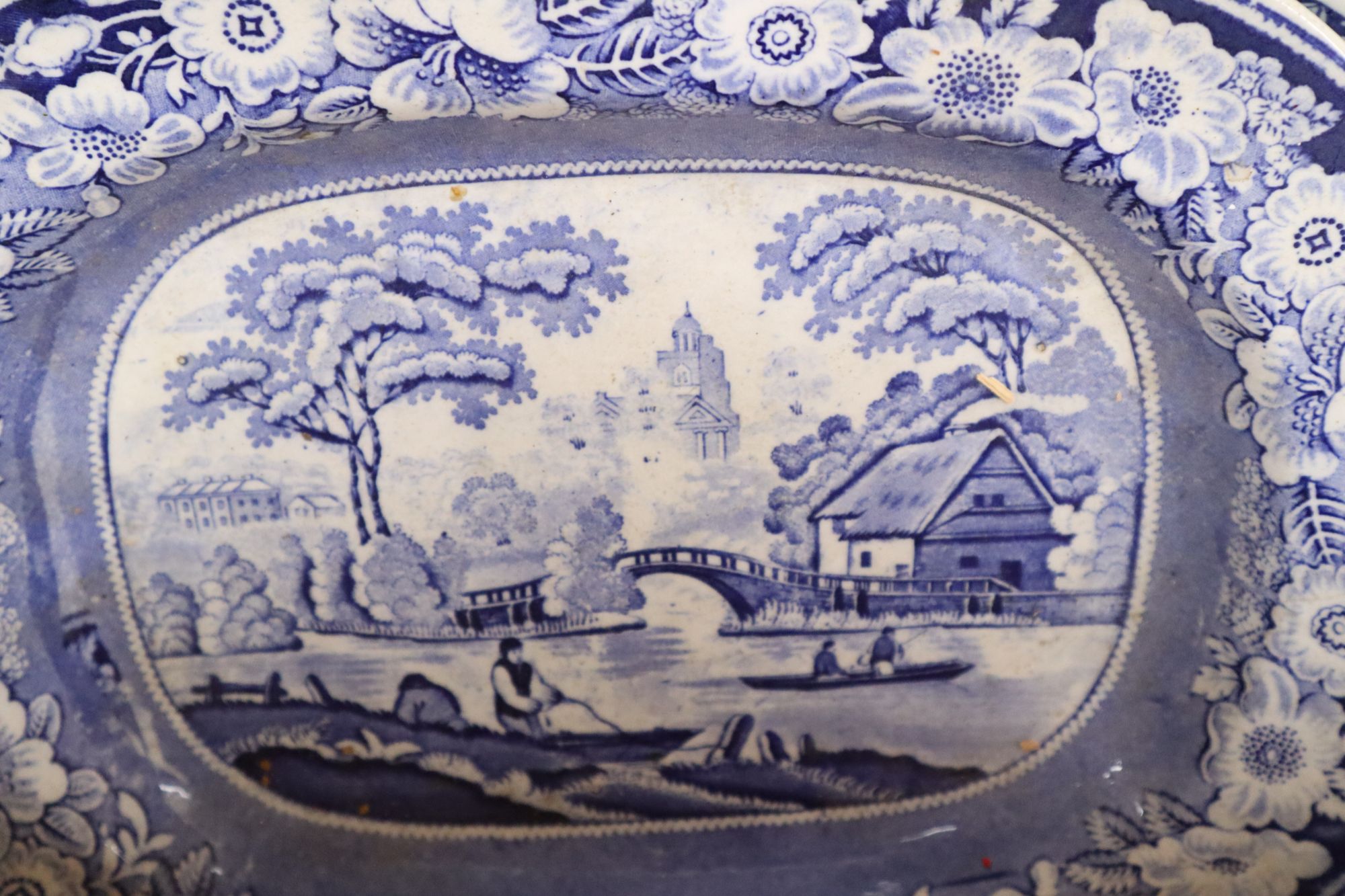 Three blue and white meat platters, largest 49cm wide, two ironstone plates and a tureen and a Delft vase